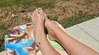 Relaxing in the sun showing off our oiled and pedicured feet