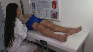 NURSE in routine care, attends to a patient with an erection