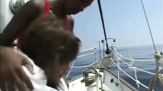 Beautiful black body on the big white cock...black and white on the yacht