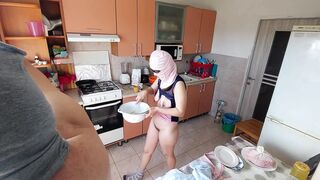 Crazy amateur couple having fun in the kitchen.