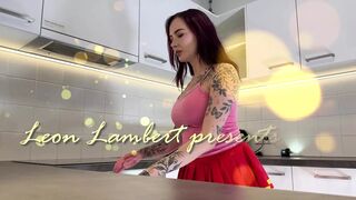 Hottest redhead tattooed cheerleader with over knee socks shows her see through panties in the kitchen